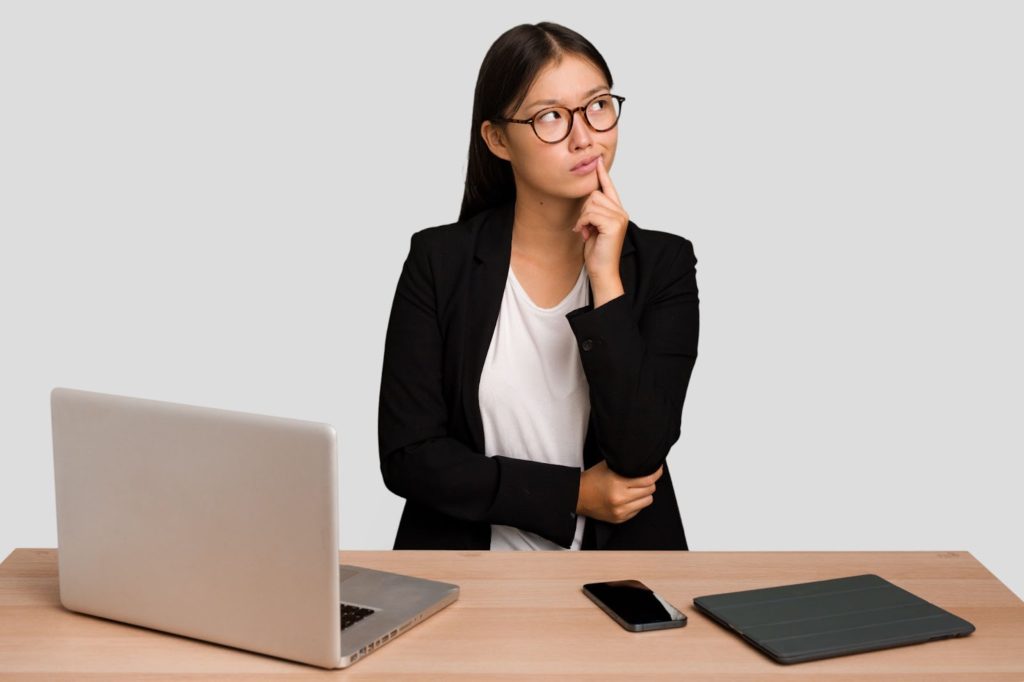 professional businesswoman thinking office desk technology