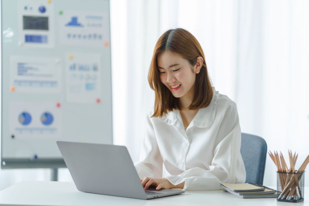 Woman typing on laptop